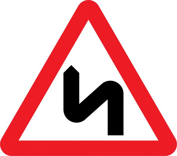 Double bend first to left road sign