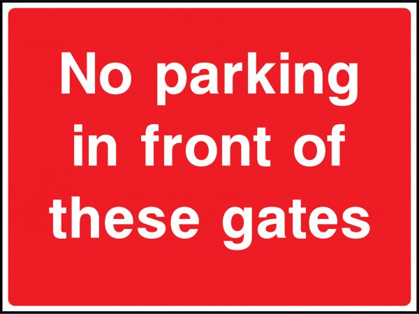 No parking in front of these gates road sign
