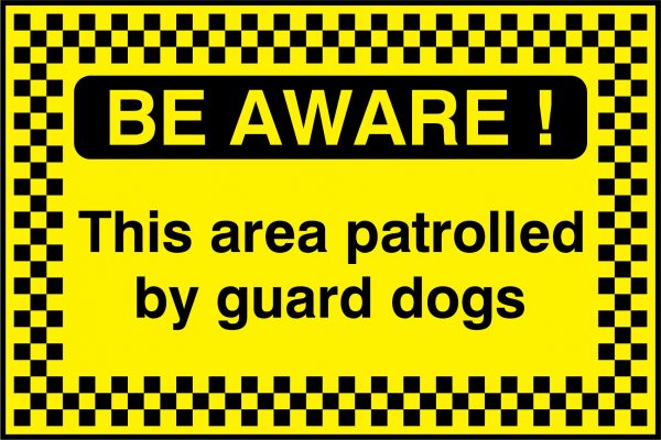 Be aware this area patrolled by guard dogs sign